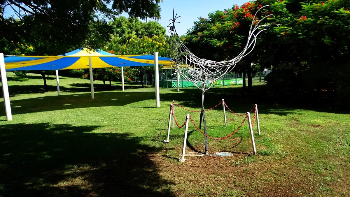 Lawns, shade sails and a wire sculpture in Kfar Saba Park, the large city park beside the HaPark area