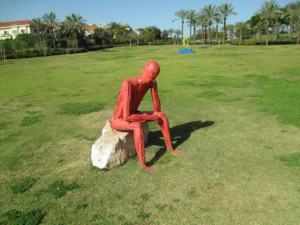 A red figure sculpture on the lawns of Kfar Saba Park (Yitzhak Wald Park)